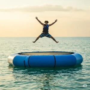 Person jumping high in the air on a durable water trampoline.