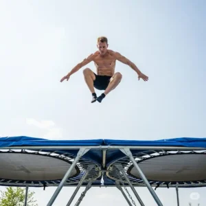 An experienced jumper performing a controlled, advanced trick on a double bounce trampoline, demonstrating its superior rebound for acrobatics.