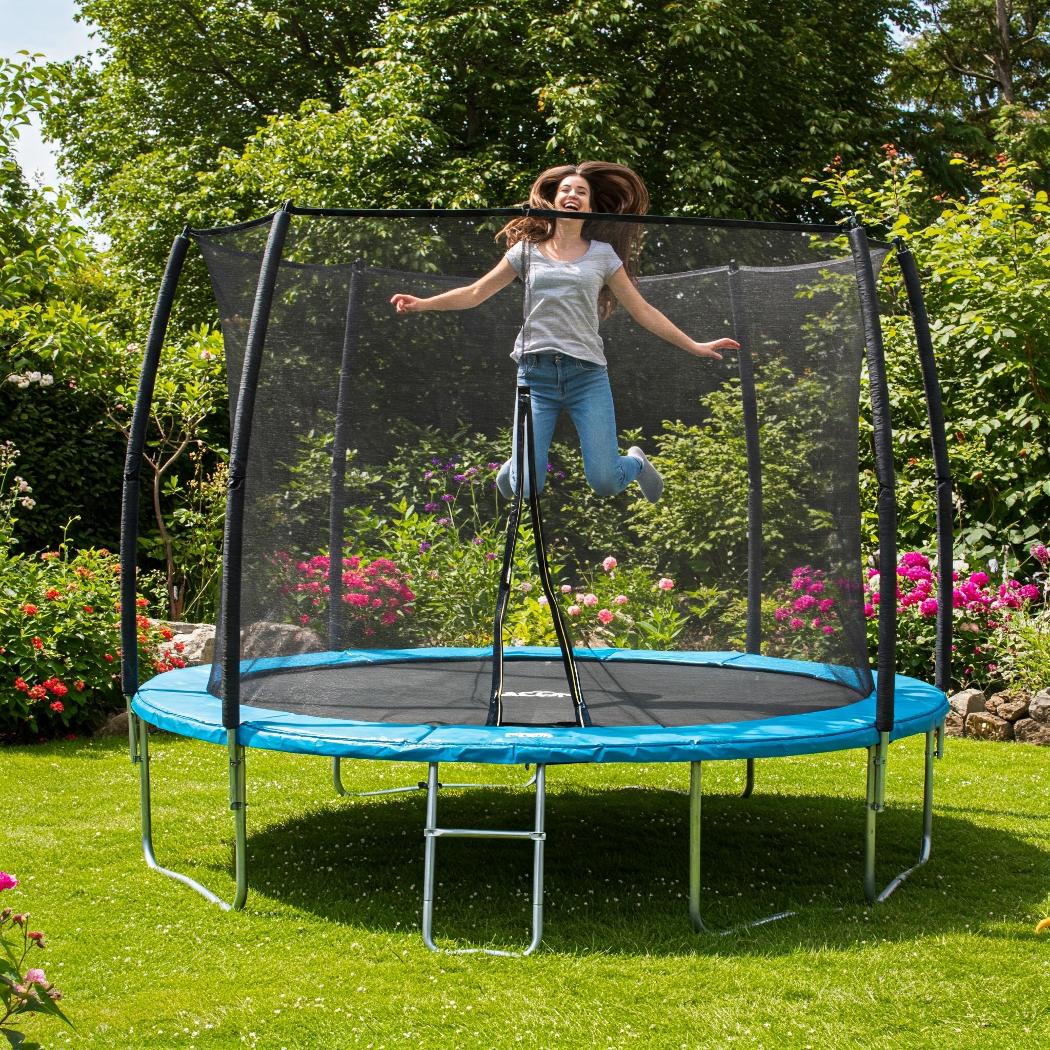 Acon trampolines providing hours of outdoor fun and exercise in a lush garden setting.