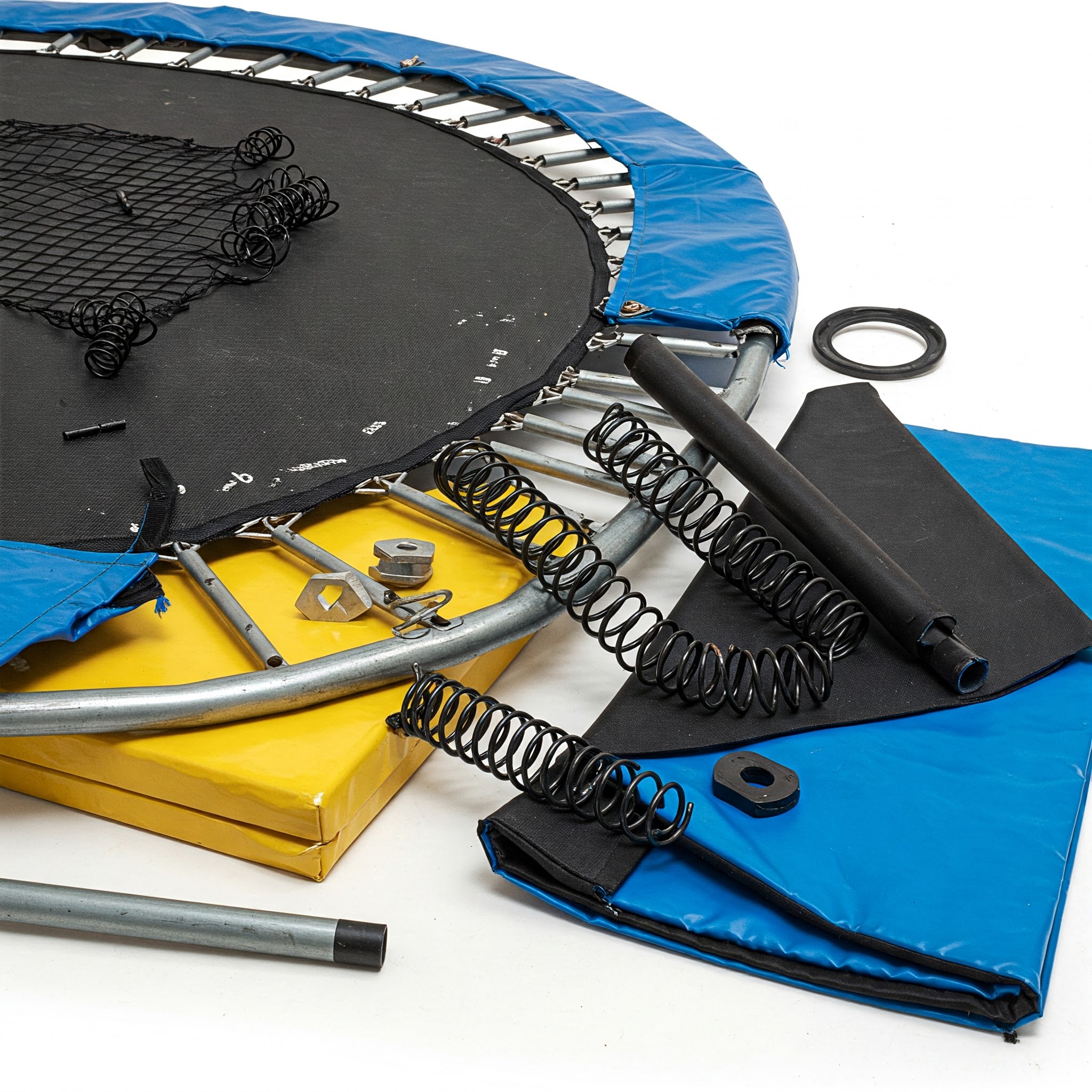 "Close-up of various materials from a disassembled trampoline, suggesting options for can you recycle material from trampoline."