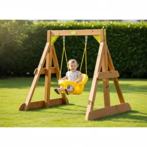A compact, low-height small backyard swing set designed for toddlers, featuring a bucket swing for safety.