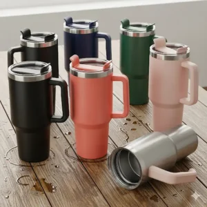 A collection of 32 oz insulated tumblers with handles in various colors, showcasing the available aesthetic choices.