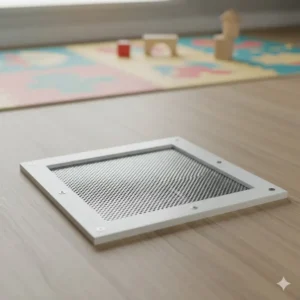 A detailed photo of a mesh cover exposed heating vents toddlers, designed with small openings to prevent items from dropping inside while maintaining airflow.