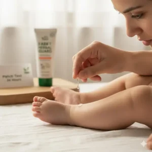 A parent performing a small patch test on a baby's leg with a small amount of non toxic bug repellents safe for babies to check for any allergic reaction.